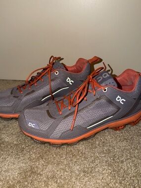 On Running women’s Athletic Shoes in Gray with Orange Accents